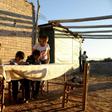 Nancy Jofre helps her four children with their homework near San Jose in the Lavalle desert area of Argentina's Mendoza province