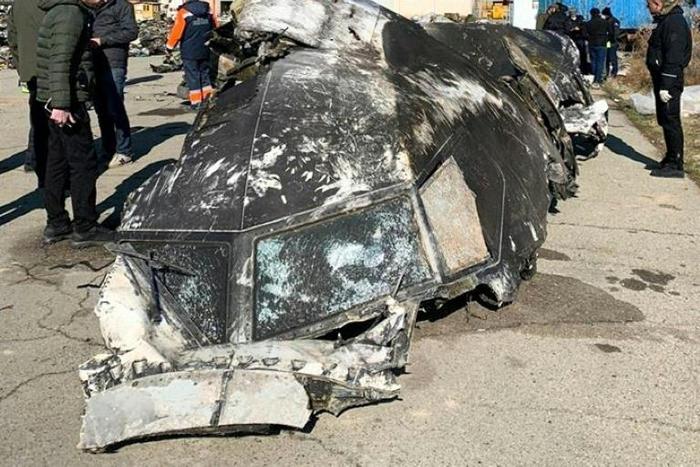 This handout photograph taken and released on January 11, 2020, by the National Security and Defense Council of Ukraine, shows the remains of the Ukraine International Airlines plane Boeing 737-800 that crashed outside Tehran on January 8, 2020