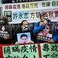 Pro-democracy protesters in Hong Kong hold placards supporting  detained rights activists including Xu Zhiyong in February 2020