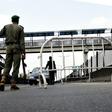 A Nigerian police officer in Lagos flags down an oncoming vehicle at a checkpoint to enforce an extended lockdown as part of measures to prevent the spread of COVID-19