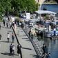 People walk on the banks of the Seine River in Paris on May 15 as France eases lockdown measures taken to curb the spread of the COVID-19 pandemic