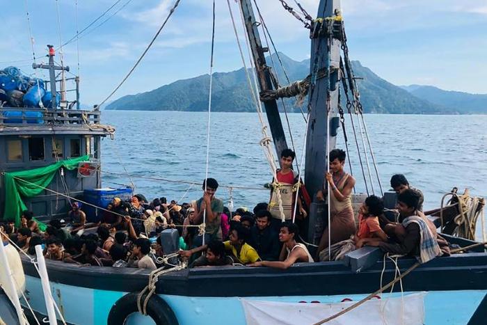 Malaysian authorities have arrested two people suspected of being human traffickers in connection with the arrival of this boat crammed with Rohingya migrants in Langkawi on April 5