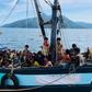 Malaysian authorities have arrested two people suspected of being human traffickers in connection with the arrival of this boat crammed with Rohingya migrants in Langkawi on April 5