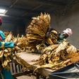 Workers wearing facemasks grade tobacco leaves at a farm in Bromley, eastern Zimbabwe