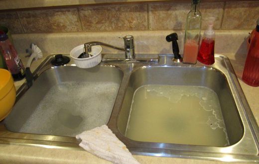 How to unclog your kitchen sink (John The Plumber)