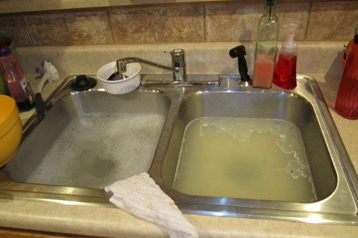 How to unclog your kitchen sink (John The Plumber)