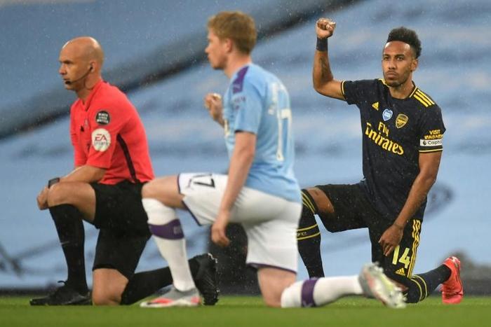 Manchester City and Arsenal players took a knee before kick-off on the Premier League's restart on Wednesday