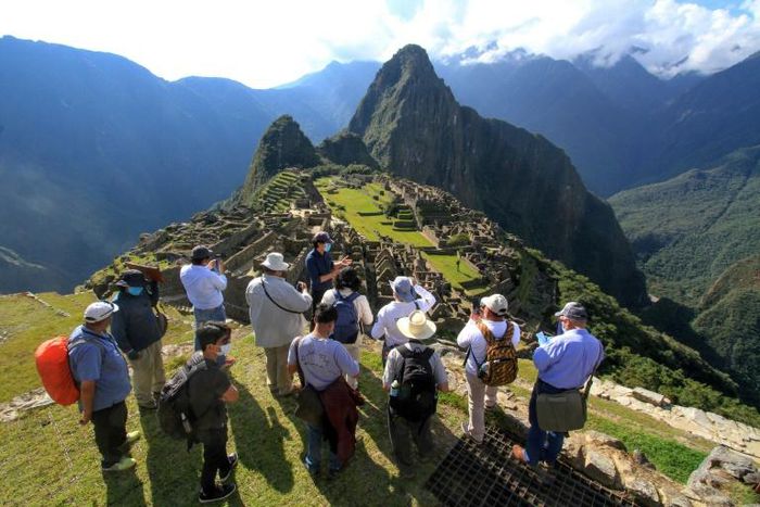 Members of a commission of authorities and experts led by the the Governor of Cusco, Jean Paul Benavente, visit the Inca citadel of Machu Picchu on June 12, 2020