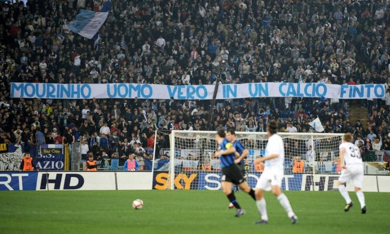 Lazio fans raise a banner that reads "Mourinho a real man in a football that is fake", celebrating Inter's charge to the league title at the expense of local rivals Roma