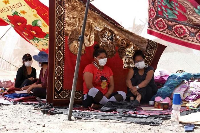 Bolivians stranded at a makeshift camp in Huara, Chile, after the border was closed to prevent the spread of the coronavirus, on April 1 2020