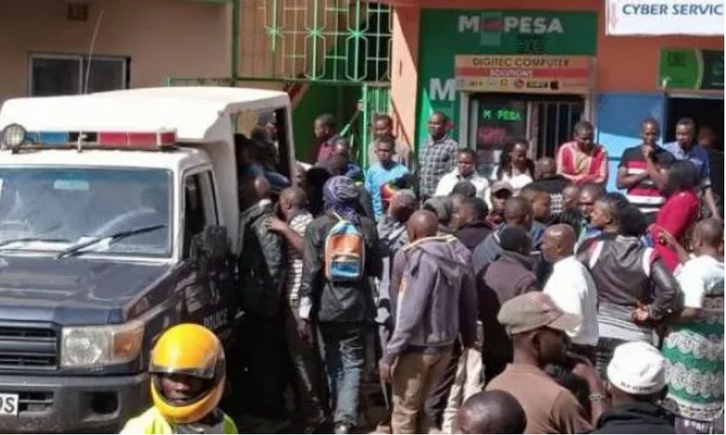File image of a crowd at a crime scene