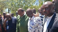 Former President Uhuru Kenyatta and Oburu Odinga at the grave of Raila Odinga in Bondo