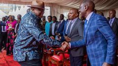 Former President Uhuru Kenyatta greeting President William Ruto during Ordination and Installation ceremony of Bishop Peter Kimani in Embu
