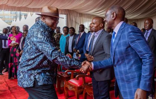 Former President Uhuru Kenyatta greeting President William Ruto during Ordination and Installation ceremony of Bishop Peter Kimani in Embu