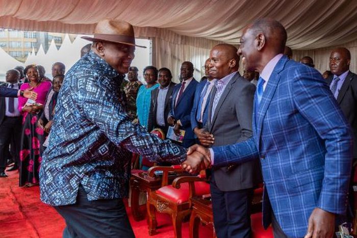 Former President Uhuru Kenyatta greeting President William Ruto during Ordination and Installation ceremony of Bishop Peter Kimani in Embu