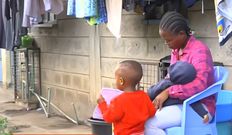 Fred Mosoti's wife, Veronica Oruta with their two children during an interview following his disappearance