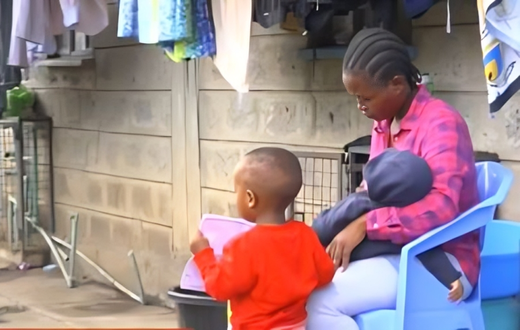 Fred Mosoti's wife, Veronica Oruta with their two children during an interview following his disappearance