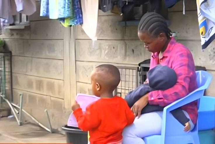 Fred Mosoti's wife, Veronica Oruta with their two children during an interview following his disappearance