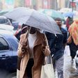 Kenyan experiencing rainfall in Nairobi