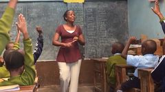 A teacher in a classroom in Kenya