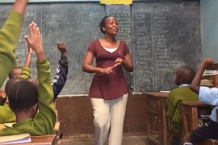 A teacher in a classroom in Kenya