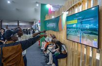 Participant at the German Pavilion in the Blue Zone, on the ninth day of the 30th Conference of the Parties (COP30). [Image Credit: Antonio Scorza]