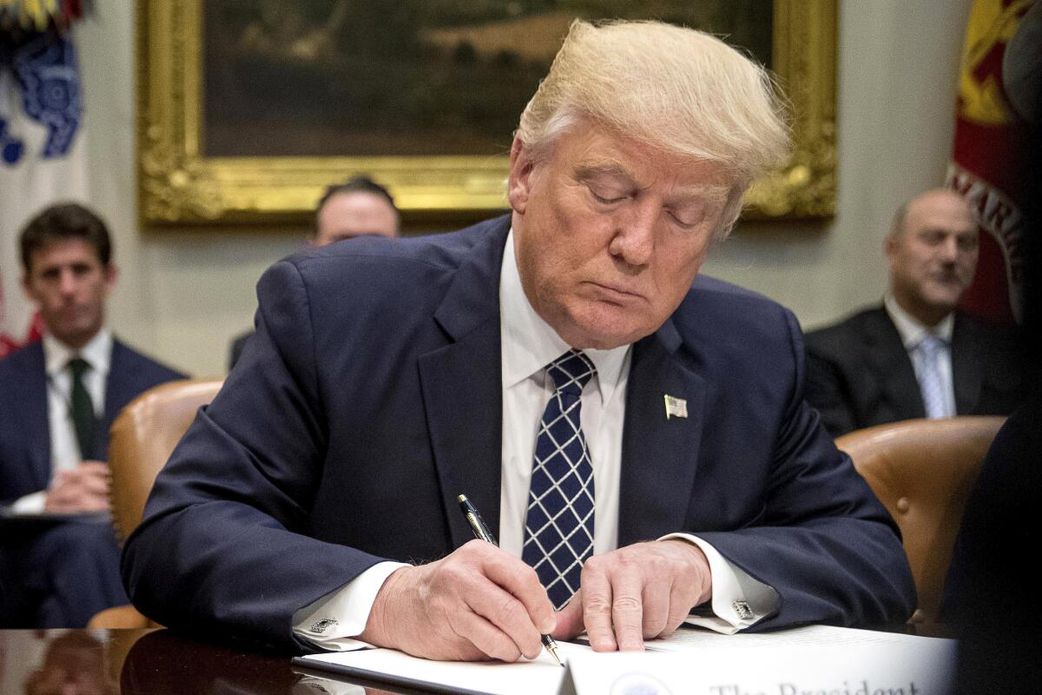 President Donald Trump signs several Executive Orders
