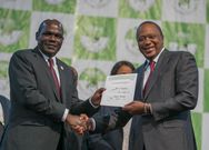 Wafula Chebukati hands the winners certificate to Uhuru Kenyatta