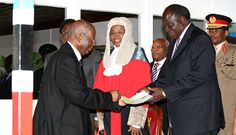 The late Samuel Kivuitu, the former chairman of the Electoral Commission of Kenya, presents the results of the 2007 presidential elections to PNU's candidate Mwai Kibaki