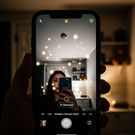 Switch to the selfie camera and scan areas where a camera could be concealed