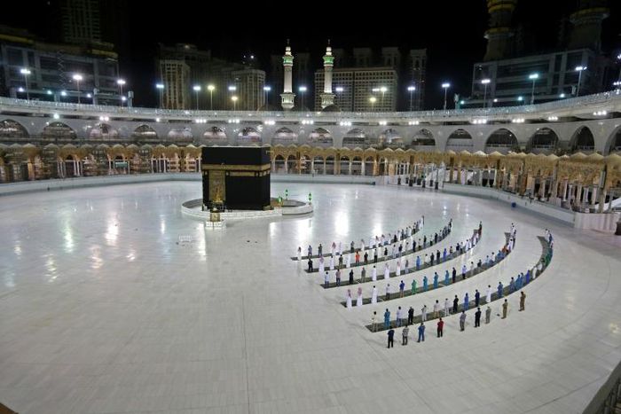 A limited number of worshippers perform prayers at the Kaaba, Islam's holiest shrine, in the Grand Mosque complex in Saudi Arabia's holy city of Mecca