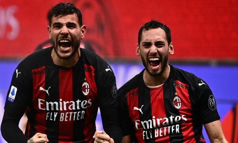 AC Milan's French defender Theo Hernandez (left) and Turkish midfielder Hakan Calhanoglu (right) have both tested positive for Covid-19