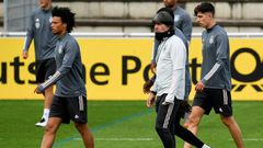 Germany head coach Joachim Loew (centre) oversees training in Stuttgart alongside Leroy Sane (left) and Kai Havertz (right).