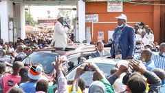 Former Prime Minister Raila Odinga and nominated MP Maina Kamanda during a tour of Burma Market, Nairobi