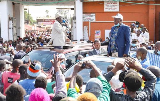 Former Prime Minister Raila Odinga and nominated MP Maina Kamanda during a tour of Burma Market, Nairobi
