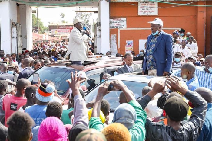 Former Prime Minister Raila Odinga and nominated MP Maina Kamanda during a tour of Burma Market, Nairobi