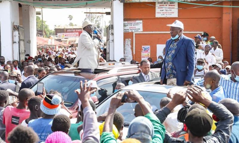 Former Prime Minister Raila Odinga and nominated MP Maina Kamanda during a tour of Burma Market, Nairobi