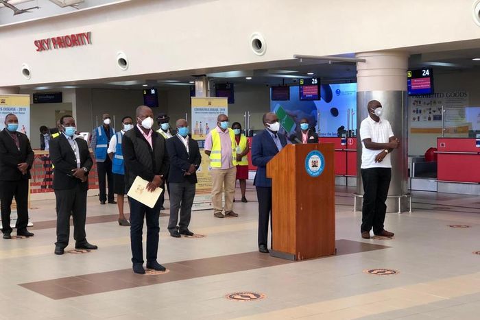 Health CS Mutahi Kagwe, Transport CS James Macharia and Ministry of Health Director General Patrick Amoth during a Covid-19 briefing from JKIA
