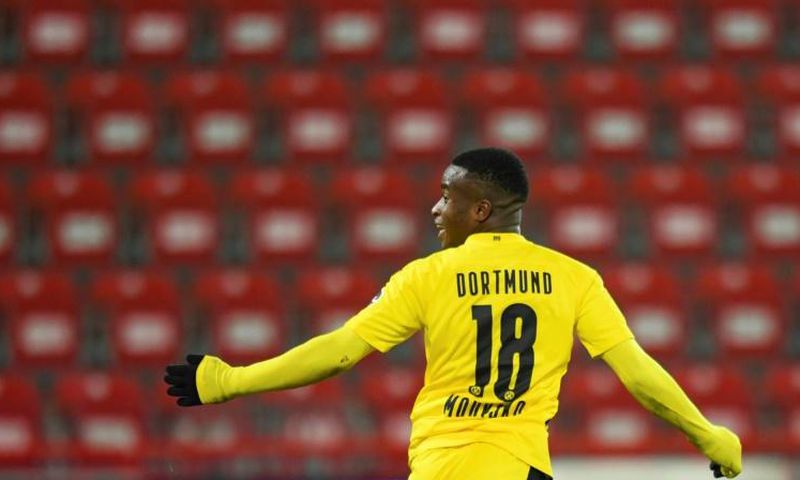 Dortmund striker Youssoufa Moukoko, 16, celebrates after becoming the youngest goal-scorer in Bundesliga history on Friday