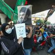 Supporters of Hezbollah hold pictures of leader Hassan Nasrallah during a protest against comments  by the US ambassador to Lebanon criticising the Shiite group back in June