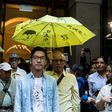 Hong Kong police are seeking to arrest Nathan Law (C) and five other democracy activists now living in exile, China's state television reported