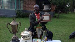 Athletics legend Benjamin Jipcho Chemaima showcasing some of his awards during a past media interview