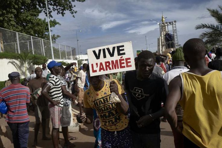 A man holding a sign reading "long live the army" at a rally in Mali's capital Bamako in support of the junta