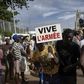 A man holding a sign reading "long live the army" at a rally in Mali's capital Bamako in support of the junta