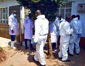 Crime scene investigators at the home where Lawrence Simon Warunge Njoroge murdered 4 family members and a mason on January 5, 2021
