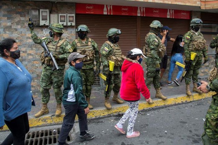 Ecuadorean soldiers wearing facemasks take part in a coronavirus public education operation in the capital, Quito
