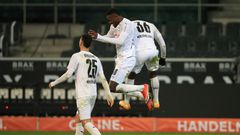 Marcus Thuram (C) celebrates scoring for Borussia Moenchengladbach in Friday's 4-2 win over Dortmund