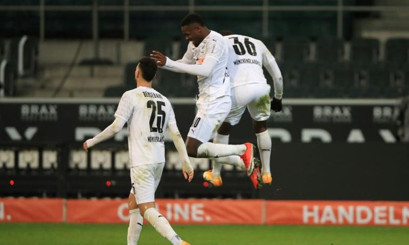 Marcus Thuram (C) celebrates scoring for Borussia Moenchengladbach in Friday's 4-2 win over Dortmund