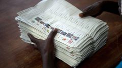 ___7579760___2017___11___10___9___A+voting+assistant+stacks+ballot+papers+marked+with+a+vote+for+presidential+candidate+Raila+Odinga+to