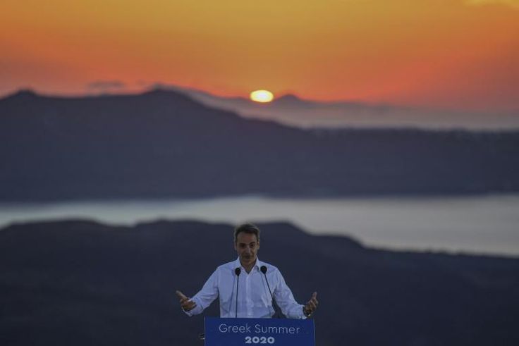 Greek Prime Minister Kyriakos Mitsotakis, seen visiting the island of Santorini, insists the Corfu project is good for the island and also respects the environment